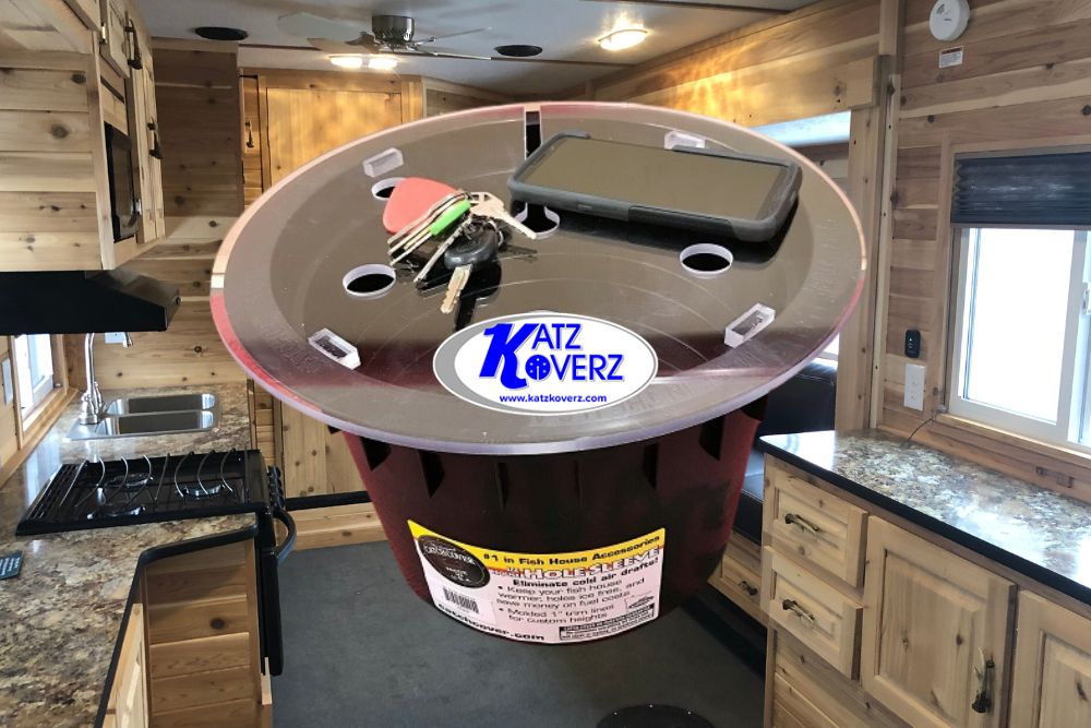 A red bucket with a Katz Koverz Clear Step Cover on it in the kitchen of a rv.