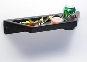 A black shelf with a can and a bottle of soda.