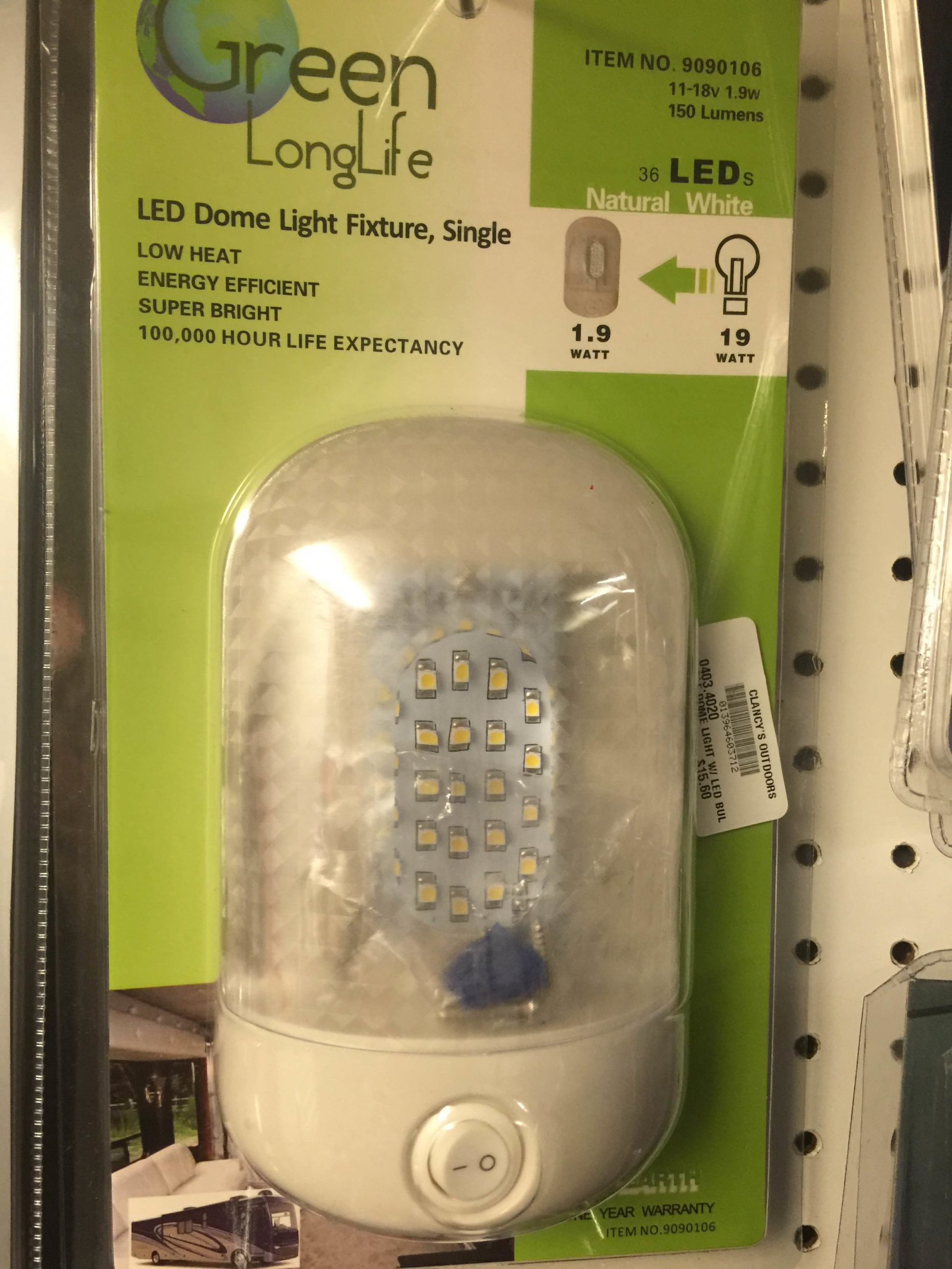 A green long light in a package in a store.