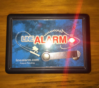 A small box with the product name LineAlarm on it.