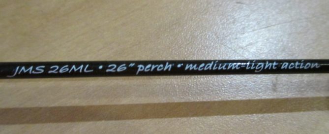 A black pen with the words jas ml 25 medium light action on it.