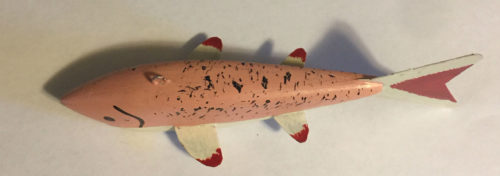 A 6-1/2 Inch Lamont Mounsdon Wood Spearing Decoys fish with red and white stripes.