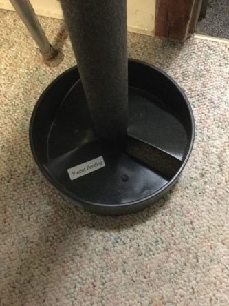 A Slush Copter cat litter tray on the floor of a room.