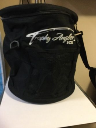 A black bag with the word Trophy Angler 12" round tip up case on it.