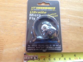 A package of the HT UltraLite Micro Fly Reel MFR-1 on a table.