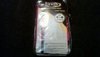 A package of Lindy Fishing Rod Tote is sitting on a black surface.