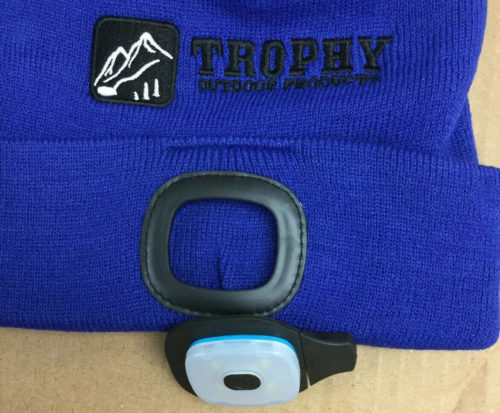 A Trophy Outdoor Rechargeable LED Knit Hat with a light attached to it.