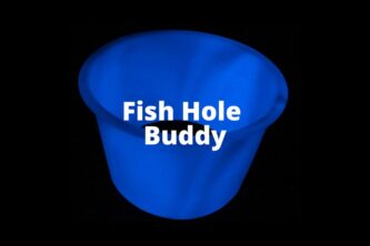 A blue cup with the words Fish Hole Buddy Glow Sleeves on it.