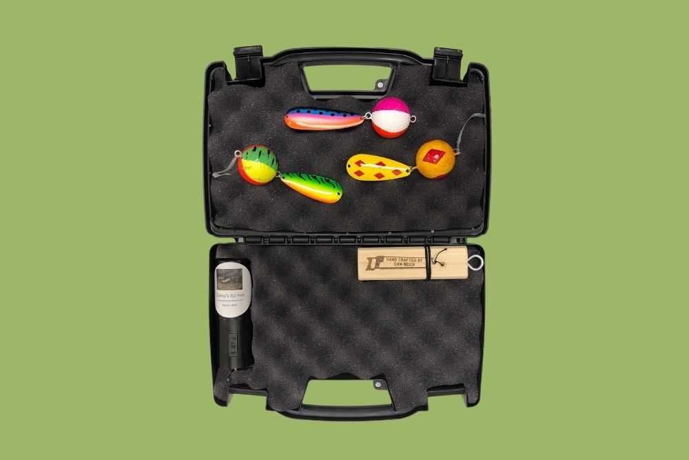 A black Northern Crack Case with several fishing lures in it.