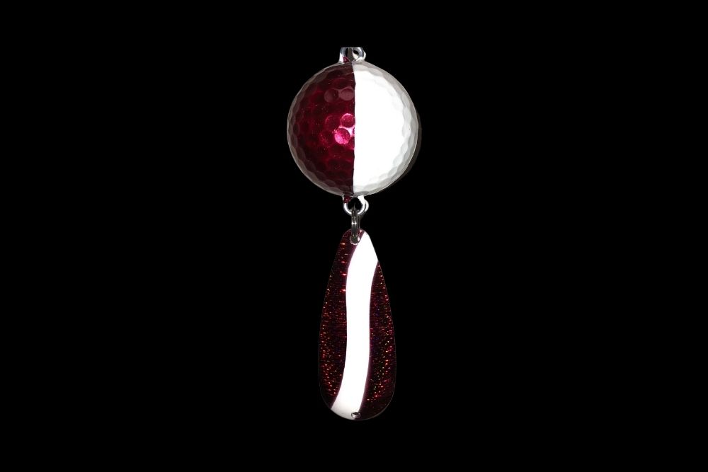 A NCS-018 Northern Crack Spearing Teaser Red and White Metallic pendant hanging on a black background.