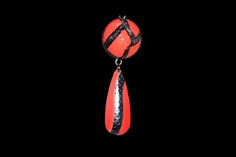An NCS-011 Northern Crack Spearing Teaser Orange Ball (Black and Silver Lines) pendant hanging on a black background.