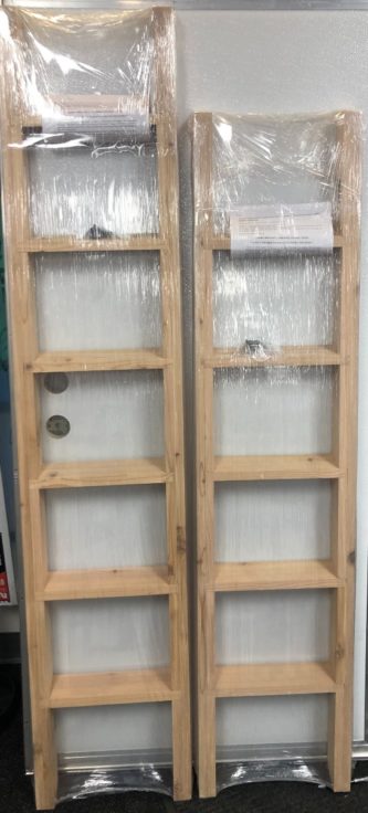 Two CEDAR BUNK LADDERS TALL OR SHORT with plastic wrap on them.