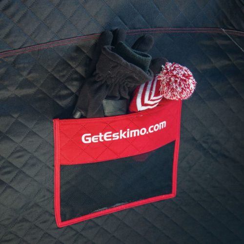 Eskimo Fatfish 949i HUB Ice Shelter in a pocket on the side of a ski bag.