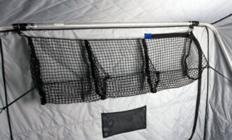 A tent with the Otter 3 pocket cargo net 201046 hanging on the side of it.