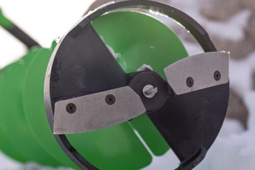 A green ION® ALPHA PLUS 8" or 10" 40 V Li Ion Ice Auger Poly with a blade on it.