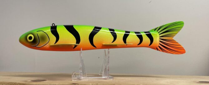 A 12" Goodin FireTiger Decoy on a stand.