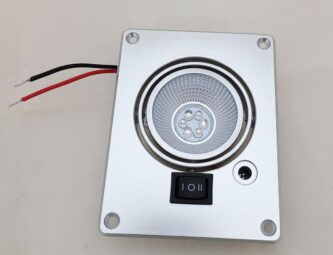 A Northern Lights Hole Light 12 VDC UV and White LED with Power Port with a wire attached to it.