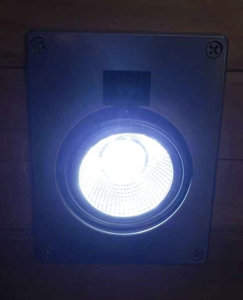 A Northern Lights Hole Light 12 VDC UV and White LED with Power Port with a light on it.