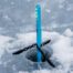 Ice anchor drilled into frozen surface.