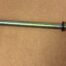 Metal rod with red strap and ring.