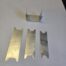 Cut aluminum shims and folded metal bracket