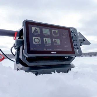 Vexilar's first live-imaging sonar is here. The Vexilar Vision™ X10 brings five display modes, built-in lake charts, and exclusive low-power Stealth Sonar™ to a 10" touchscreen built for the toughest winter conditions. 10" Touchscreen + Buttons A 10" touchscreen display with digitally enhanced brightness, paired with physical buttons so you can operate with gloves on. One Bar. Two Cones A single-bar transducer produces two frequency-steered 36° cones (one down, one forward). Swap views quickly without pulling the transducer out of the water. Stealth Sonar Technology High-power live sonar seems to push fish. The Vision X10's exclusive Stealth Sonar™ aims to minimize the effect on fish. Sidekick Compatibility Exclusive Patent Pending Wireless Connection to the Vexilar Sidekick®